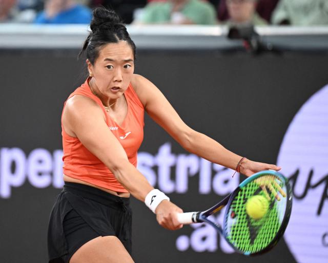 USA's Ann Li returns the ball to Ukraine's Dayana Yastremska during their women's singles match of the WTA Upper Austria Ladies Linz tennis tournament in Linz, Austria on April 7, 2026. Yastremska won the match 7-5, 4-6 and 6-3. (Photo by BARBARA GINDL / APA / AFP) / Austria OUT