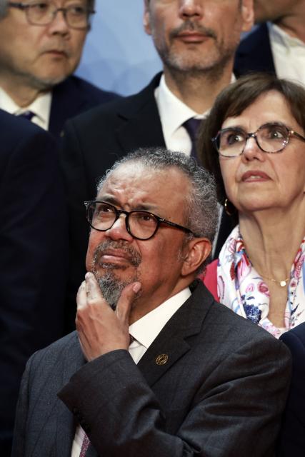 World Health Organization (WHO) Director-General Tedros Adhanom Ghebreyesus (C) attends a family photo during the "One Health Summit" high-level meeting session in Lyon, southern France on April 7, 2026, on the occasion of World Health Day. (Photo by Christophe PETIT TESSON / POOL / AFP)
