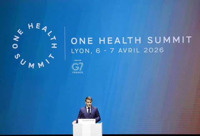France's President Emmanuel Macron delivers his speech during the opening session of "One Health Summit" high-level meeting in Lyon, southern France on April 7, 2026, on the occasion of World Health Day. (Photo by Christophe PETIT TESSON / POOL / AFP)