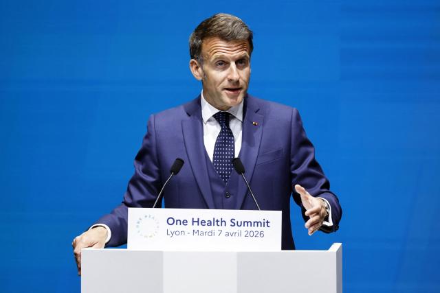France's President Emmanuel Macron delivers his speech during the opening session of "One Health Summit" high-level meeting in Lyon, southern France on April 7, 2026, on the occasion of World Health Day. (Photo by Christophe PETIT TESSON / POOL / AFP)