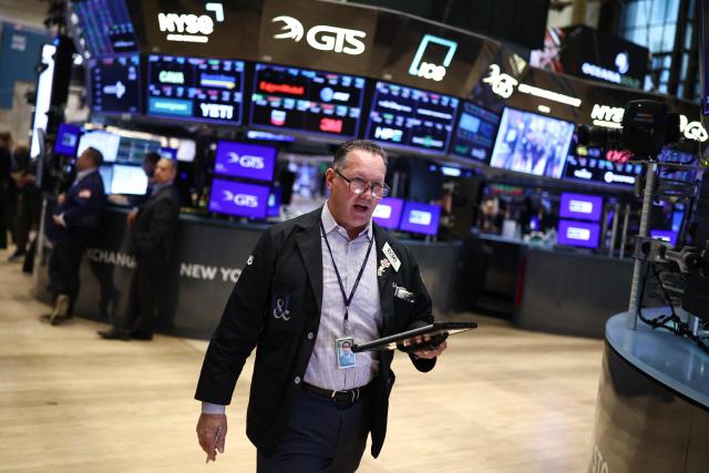 A trader works on the floor of the New York Stock Exchange (NYSE) at the opening bell in New York City on April 7, 2026. Oil prices jumped Tuesday and stocks fell after US-Israeli strikes on the key Iranian oil export terminal of Kharg island, with investors bracing for US President Donald Trump's looming deadline for Iran to reopen the Strait of Hormuz or face devastating attacks. (Photo by CHARLY TRIBALLEAU / AFP)