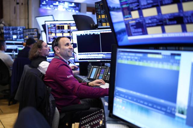 Traders work on the floor of the New York Stock Exchange (NYSE) at the opening bell in New York City on April 7, 2026. Oil prices jumped Tuesday and stocks fell after US-Israeli strikes on the key Iranian oil export terminal of Kharg island, with investors bracing for US President Donald Trump's looming deadline for Iran to reopen the Strait of Hormuz or face devastating attacks. (Photo by CHARLY TRIBALLEAU / AFP)