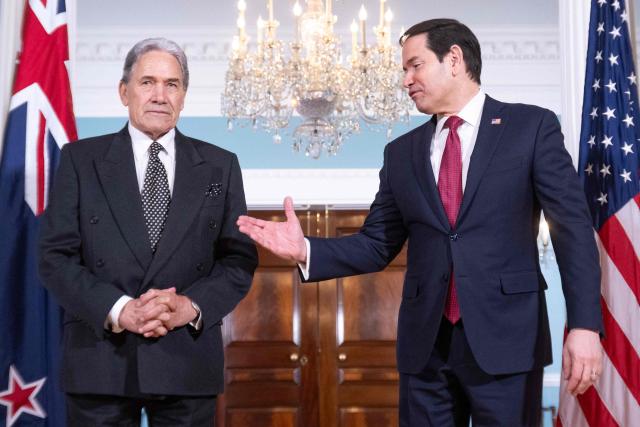 US Secretary of State Marco Rubio (R) extends his hand for a handshake to New Zealand Foreign Minister Winston Peters (L) prior to meetings at the State Department in Washington, DC, on April 7, 2026. (Photo by SAUL LOEB / AFP)