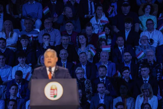 Audience members listen to Hungarian Prime Minister Viktor Orban during a rally supported by US Vice President JD Vance (not in picture) at the MTK Sportpark in Budapest on April 7, 2026. US Vice President JD Vance is in Hungary to deliver the US President's support to his ally, nationalist Prime Minister Viktor Orban, ahead of tightly contested parliamentary elections scheduled for April 12, 2026. (Photo by Jonathan Ernst / POOL / AFP)