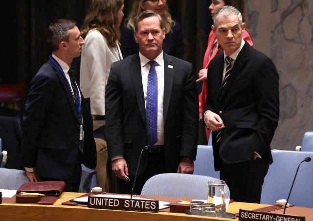 (L/R) Interim UK Ambassador to the UN Archie Young, US Ambassador to the UN Mike Waltz, and French Ambassador to the UN Jerome Bonnafont wait for the start of a United Nations Security Council meeting on Iran and the Middle East at UN headquarters in New York on April 7, 2026. The UN Security Council is expected to vote Tuesday on a watered-down resolution calling for the unblocking of the Strait of Hormuz -- far from the sponsoring Gulf countries' initial goal of obtaining clearance to free it by force. The vote comes just hours before Donald Trump's 8:00 pm (midnight GMT) deadline for Iran to make a deal or face the US military destroying its power plants and bridges. (Photo by TIMOTHY A. CLARY / AFP)