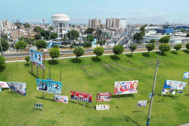 This aerial view shows political advertising in Callao, on the outskirts of Lima, Peru, on April 7, 2026. Peru will hold presidential elections on April 12. (Photo by Luis ROBAYO / AFP)