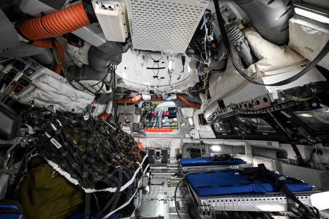 A view through a window of the Orion spacecraft mockup on April 7, 2026 at Johnson Space Center in Houston, Texas. After completing their lunar flyby -- breaking the record for distance from Earth -- the Artemis II crew is bound for home, with splashdown due in the Pacific off the coast of California late April 10. (Photo by RONALDO SCHEMIDT / AFP)