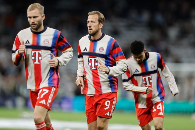 Bayern Munich's English forward #09 Harry Kane warms up with teammates before the UEFA Champions League quarter final first leg football match between Real Madrid CF and FC Bayern Munich at Santiago Bernabeu Stadium in Madrid on April 7, 2026. (Photo by Oscar DEL POZO / AFP)
