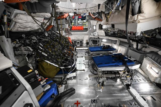 A view through a window of the Orion spacecraft mockup on April 7, 2026 at Johnson Space Center in Houston, Texas. After completing their lunar flyby -- breaking the record for distance from Earth -- the Artemis II crew is bound for home, with splashdown due in the Pacific off the coast of California late April 10. (Photo by RONALDO SCHEMIDT / AFP)