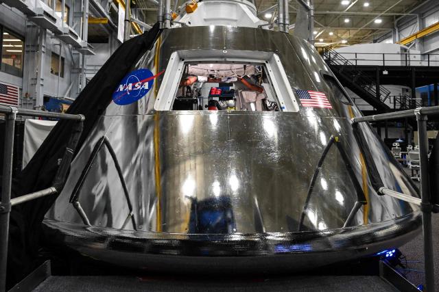 A mockup of the Orion spacecraft is seen on April 7, 2026 at Johnson Space Center in Houston, Texas. After completing their lunar flyby -- breaking the record for distance from Earth -- the Artemis II crew is bound for home, with splashdown due in the Pacific off the coast of California late April 10. (Photo by RONALDO SCHEMIDT / AFP)