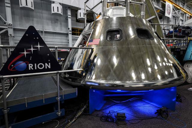 A mockup of the Orion spacecraft is seen on April 7, 2026 at Johnson Space Center in Houston, Texas. After completing their lunar flyby -- breaking the record for distance from Earth -- the Artemis II crew is bound for home, with splashdown due in the Pacific off the coast of California late April 10. (Photo by RONALDO SCHEMIDT / AFP)