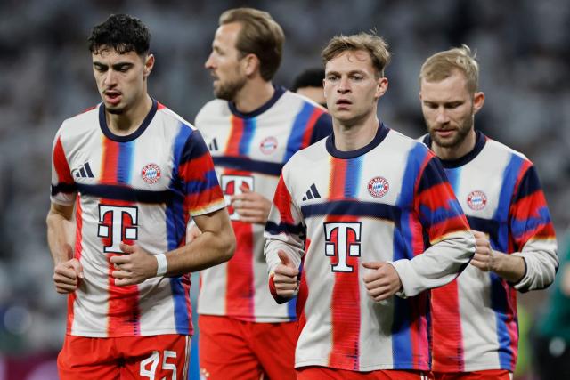 (From L) Bayern Munich's German midfielder #45 Aleksandar Pavlovic, Bayern Munich's English forward #09 Harry Kane, Bayern Munich's German midfielder #06 Joshua Kimmich and Bayern Munich's Austrian midfielder #27 Konrad Laimer warm up before the UEFA Champions League quarter final first leg football match between Real Madrid CF and FC Bayern Munich at Santiago Bernabeu Stadium in Madrid on April 7, 2026. (Photo by Oscar DEL POZO / AFP)