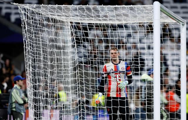 Bayern Munich's German goalkeeper #01 Manuel Neuer warms up before the UEFA Champions League quarter final first leg football match between Real Madrid CF and FC Bayern Munich at Santiago Bernabeu Stadium in Madrid on April 7, 2026. (Photo by Oscar DEL POZO / AFP)
