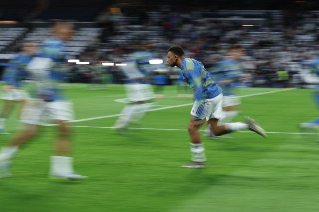 Real Madrid's French forward #10 Kylian Mbappe warms up before the UEFA Champions League quarter final first leg football match between Real Madrid CF and FC Bayern Munich at Santiago Bernabeu Stadium in Madrid on April 7, 2026. (Photo by Thomas COEX / AFP)
