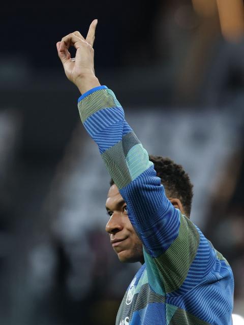 Real Madrid's French forward #10 Kylian Mbappe warms up before the UEFA Champions League quarter final first leg football match between Real Madrid CF and FC Bayern Munich at Santiago Bernabeu Stadium in Madrid on April 7, 2026. (Photo by Thomas COEX / AFP)