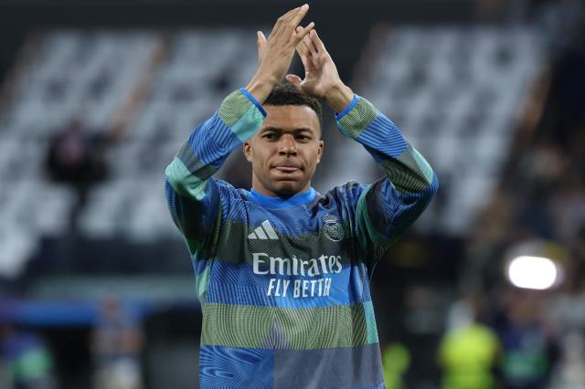 Real Madrid's French forward #10 Kylian Mbappe warms up before the UEFA Champions League quarter final first leg football match between Real Madrid CF and FC Bayern Munich at Santiago Bernabeu Stadium in Madrid on April 7, 2026. (Photo by Thomas COEX / AFP)