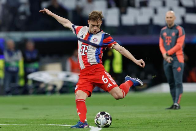 Bayern Munich's German midfielder #06 Joshua Kimmich kicks the ball during the warm up before the UEFA Champions League quarter final first leg football match between Real Madrid CF and FC Bayern Munich at Santiago Bernabeu Stadium in Madrid on April 7, 2026. (Photo by Oscar DEL POZO / AFP)