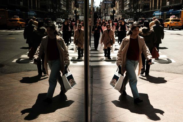 Pedestrians and cars move along Lexington Avenue in the Manhattan borough of New York City on April 7, 2026. (Photo by CHARLY TRIBALLEAU / AFP)
