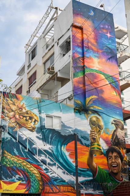 View of a mural by Mexican artist Ivan Bailon Hernandez titled "Sueno Mundialista" (World Cup dream), referring to the upcoming FIFA World Cup 2026, in Acapulco, Guerrero state, Mexico, on April 7, 2026. (Photo by Faustine FRANCISCO / AFP)