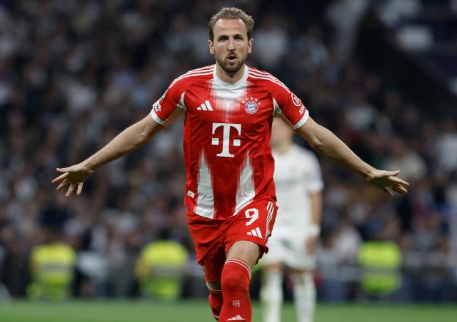 Bayern Munich's English forward #09 Harry Kane celebrates scoring his team's second goal during the UEFA Champions League quarter final first leg football match between Real Madrid CF and FC Bayern Munich at Santiago Bernabeu Stadium in Madrid on April 7, 2026. (Photo by Oscar DEL POZO / AFP)