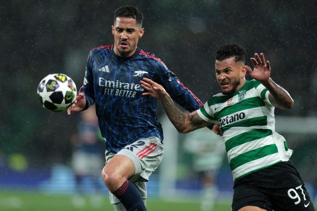 Arsenal's French defender #02 William Saliba (L) and Sporting Lisbon's Colombian forward #97 Luis Suarez fight for the ball during the UEFA Champions League quarter final first leg football match between Sporting CP and Arsenal at Jose Alvalade stadium in Lisbon on April 7, 2026. (Photo by PATRICIA DE MELO MOREIRA / AFP)