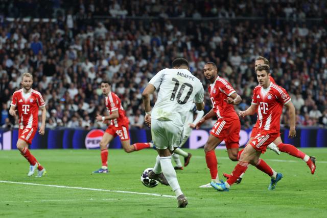Real Madrid's French forward #10 Kylian Mbappe shoots at goal during the UEFA Champions League quarter final first leg football match between Real Madrid CF and FC Bayern Munich at Santiago Bernabeu Stadium in Madrid on April 7, 2026. (Photo by Thomas COEX / AFP)