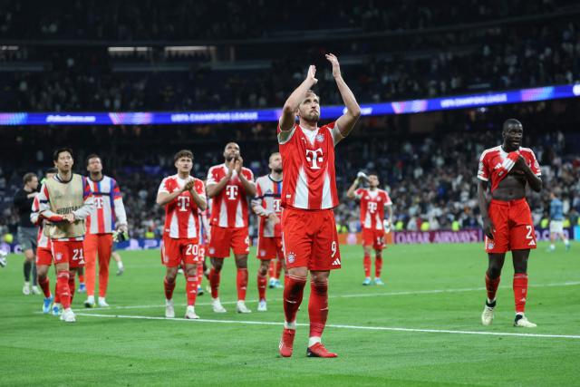 Bayern Munich's English forward #09 Harry Kane and Bayern players react after the UEFA Champions League quarter final first leg football match between Real Madrid CF and FC Bayern Munich at Santiago Bernabeu Stadium in Madrid on April 7, 2026. (Photo by Pierre-Philippe MARCOU / AFP)