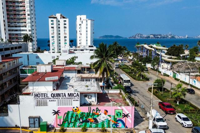 This aerial view shows a football-themed mural in Acapulco, Mexico on April 7, 2026. (Photo by Francisco ROBLES / AFP)