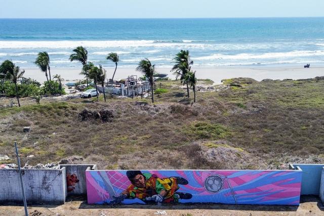 This aerial view shows a mural depicting former Mexican football goalkeeper Jorge Campos in Acapulco, Mexico on April 7, 2026. (Photo by Francisco  ROBLES / AFP)