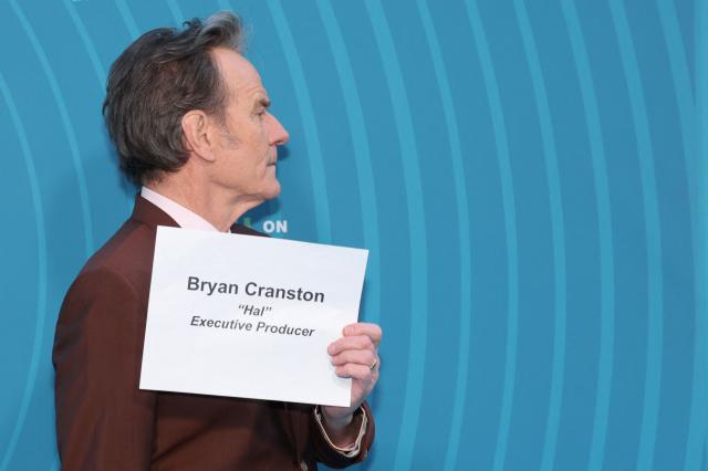 US actor and executive producer Bryan Cranston holds his name slate while attending Hulu's "Malcolm in the Middle: Life's Still Unfair" premiere at the DGA Theater in New York on April 7, 2026. (Photo by ANGELA WEISS / AFP)