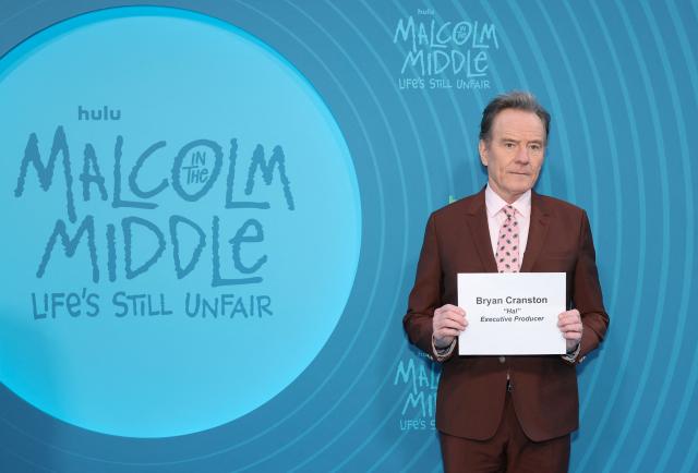 US actor and executive producer Bryan Cranston holds his name slate while attending Hulu's "Malcolm in the Middle: Life's Still Unfair" premiere at the DGA Theater in New York on April 7, 2026. (Photo by ANGELA WEISS / AFP)