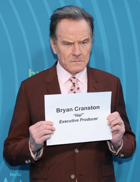 US actor and executive producer Bryan Cranston holds his name slate while attending Hulu's "Malcolm in the Middle: Life's Still Unfair" premiere at the DGA Theater in New York on April 7, 2026. (Photo by ANGELA WEISS / AFP)