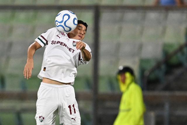 Fluminense's Venezuelan forward #11 Jefferson Savarino jumps to control the ball during the Copa Libertadores group stage football match between Venezuela's Deportivo La Guaira and Brazil's Fluminense at the Olimpico de la UCV stadium in Caracas on April 7, 2026. (Photo by Juan BARRETO / AFP)