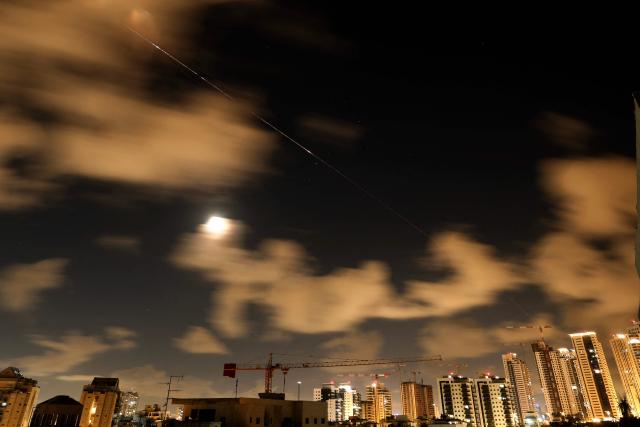 Rocket trails are seen in the sky above the Netanya, Israel, on April 8, 2026. Israel's military issued two warnings in quick succession early Wednesday that Iran had fired missiles toward it, moments after US President Donald Trump said he had agreed to postpone striking Iranian infrastructure. (Photo by JACK GUEZ / AFP) / 