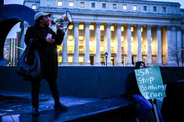 Demonstrators gather to protest against US military action in Iran in the Manhattan borough of New York City on April 7, 2026. US President Donald Trump said on April 7 he agreed to suspend bombing of Iran for two weeks as part of a ceasefire deal if Tehran completely reopens the vital Strait of Hormuz. The announcement came after Pakistan made a last-minute proposal to avert massive US attacks on Iran, with Trump warning a "whole civilization will die tonight" unless a deal was agreed. (Photo by CHARLY TRIBALLEAU / AFP)