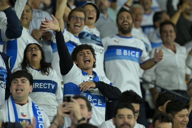 Fans of Universidad Catolica react during the Copa Libertadores group stage football match between Chile's Universidad Catolica and Argentina's Boca Juniors at the Claro Arena stadium in Santiago on April 7, 2026. (Photo by Rodrigo ARANGUA / AFP)