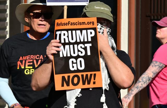 Protestors rally against US military action in Iran during a demonstration in Los Angeles on April 7, 2026. On April 7, US President Donald Trump warned that "a whole civilization will die" in Iran if the country does not heed his midnight cutoff to open the Strait of Hormuz, as Tehran reported US-Israeli attacks on its infrastructure were already underway. (Photo by Frederic J. BROWN / AFP)