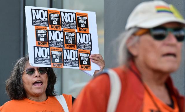 Protestors rally against US military action in Iran during a demonstration in Los Angeles on April 7, 2026. On April 7, US President Donald Trump warned that "a whole civilization will die" in Iran if the country does not heed his midnight cutoff to open the Strait of Hormuz, as Tehran reported US-Israeli attacks on its infrastructure were already underway. (Photo by Frederic J. BROWN / AFP)