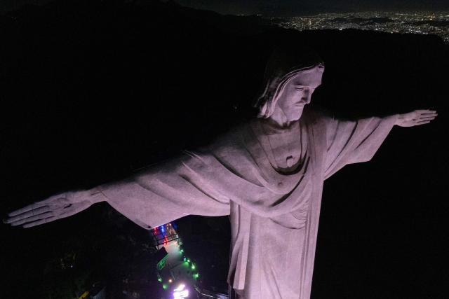 This aerial view shows the Christ the Redeemer statue on Corcovado mountain in the Tijuca Forest National Park in Rio de Janeiro, Brazil on April 7, 2026. (Photo by Pablo PORCIUNCULA / AFP)