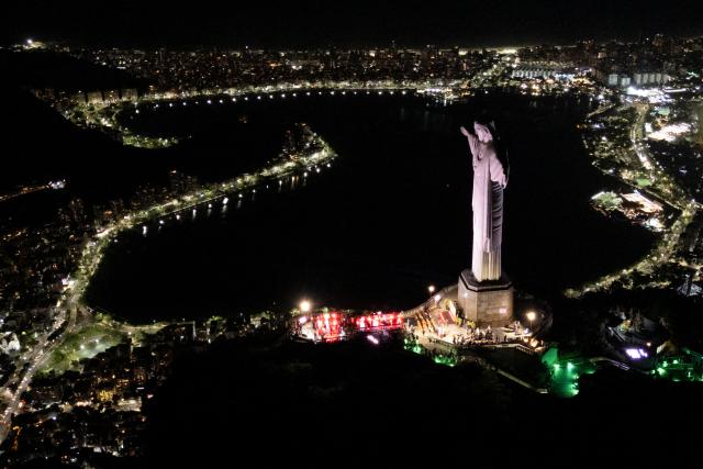 This aerial view shows the Christ the Redeemer statue on Corcovado mountain in the Tijuca Forest National Park in Rio de Janeiro, Brazil on April 7, 2026. (Photo by Pablo PORCIUNCULA / AFP)
