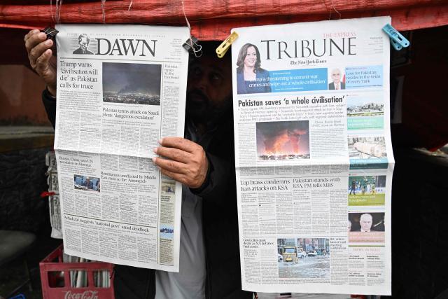A vendor displays morning newspapers at his roadside stall in Islamabad on April 8, 2026. Pakistan's Prime Minister Shehbaz Sharif said on April 8 that the United States, Iran and their allies had agreed to a ceasefire "everywhere", including Lebanon, following mediation by his government to stop weeks of fighting. (Photo by Aamir QURESHI / AFP)