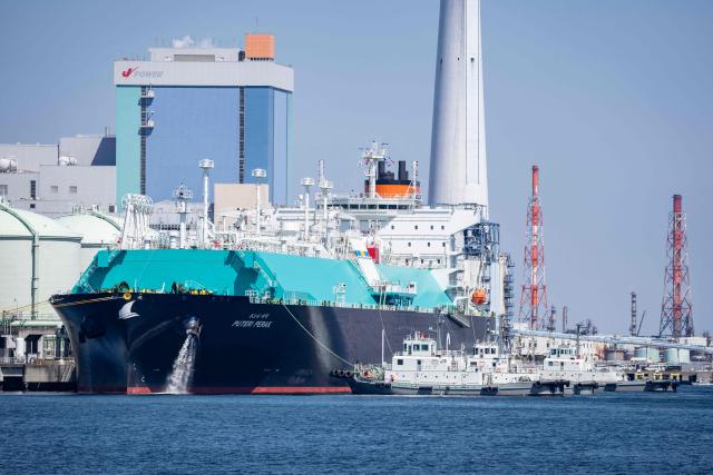 A tanker ship is moored at a liquefied natural gas (LNG) terminal in Yokohama, Kanagawa prefecture on April 8, 2026. (Photo by Yuichi YAMAZAKI / AFP)