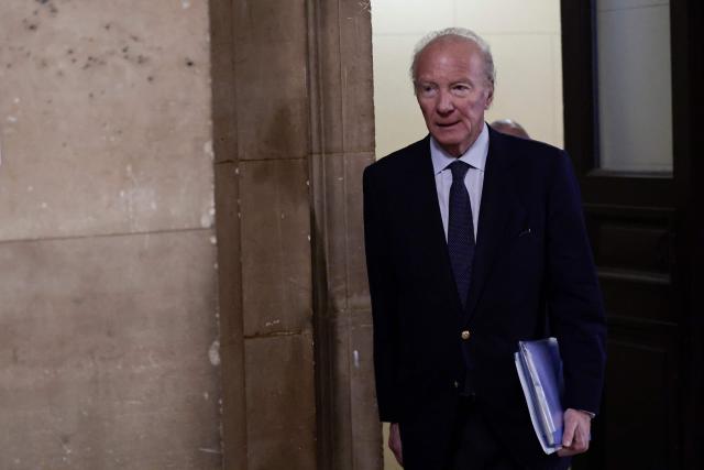 Defendant Brice Hortefeux, French former Interior Minister arrives for the appeal trial of France's former president over charges he sought Libyan financing for his 2007 election, at the Palais de Justice courthouse in Paris on April 8, 2026. The Paris Criminal Court in September 2025 convicted Sarkozy of criminal conspiracy and handed him a 5-year prison sentence over what it said was a scheme to acquire funding from Muammar Gaddafi's Libya for his 2007 presidential run that saw him elected. The right-wing politician -- who has denied any wrongdoing -- entered a Paris jail in October 2025, serving 20 days before he was released under judicial supervision. (Photo by STEPHANE DE SAKUTIN / AFP)