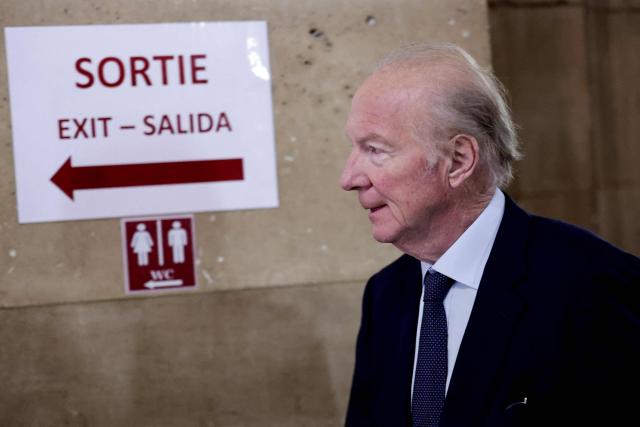 Defendant Brice Hortefeux, French former Interior Minister arrives for the appeal trial of France's former president over charges he sought Libyan financing for his 2007 election, at the Palais de Justice courthouse in Paris on April 8, 2026. The Paris Criminal Court in September 2025 convicted Sarkozy of criminal conspiracy and handed him a 5-year prison sentence over what it said was a scheme to acquire funding from Muammar Gaddafi's Libya for his 2007 presidential run that saw him elected. The right-wing politician -- who has denied any wrongdoing -- entered a Paris jail in October 2025, serving 20 days before he was released under judicial supervision. (Photo by STEPHANE DE SAKUTIN / AFP)