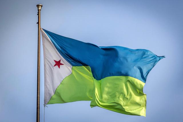 The Djiboutian flag waves atop a government building in downtown Djibouti, on April 7, 2026, ahead of the 2026 Djiboutian presidential elections. (Photo by Luis TATO / AFP)