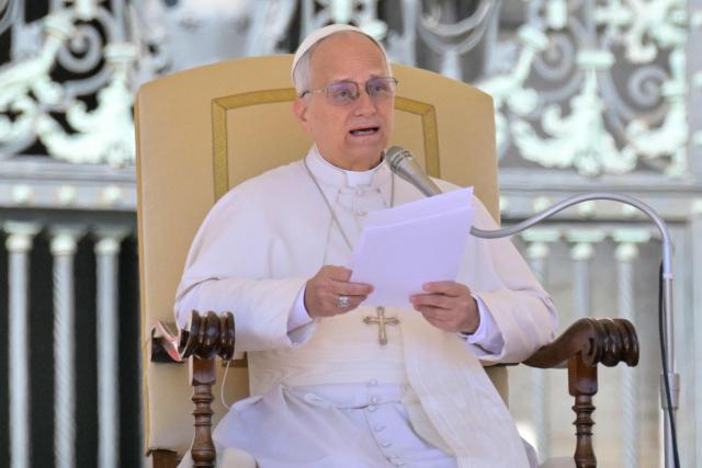 Pope Leo XIV addresses the crowd during the weekly general audience at St Peter's Square in The Vatican on April 8, 2026. (Photo by Tiziana FABI / AFP)