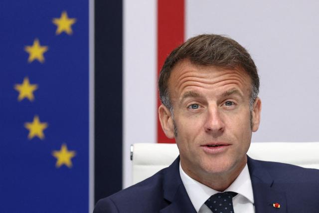 France's President Emmanuel Macron addresses a national defence council meeting on Middle East war at The Elysee Presidential Palace in Paris on April 8, 2026. French nationals, who spent more than three years in an Iranian prison on espionage charges, headed home from the war-stricken country on April, 7, 2026 Macron said. (Photo by Tom Nicholson / POOL / AFP)