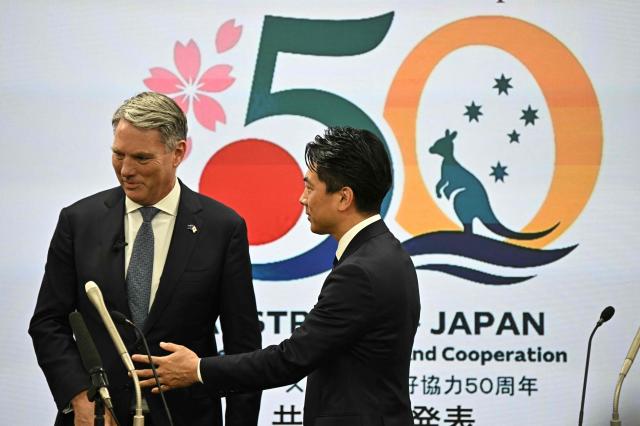 Australia's Defence Minister Richard Marles (L) and Japan's Defence Minister Shinjiro Koizumi take part in a joint press conference at the Defence Ministry in Tokyo on April 8, 2026. (Photo by Philip FONG / AFP)