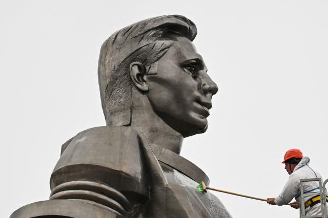 Maintenance workers clean the monument of Soviet cosmonaut Yuri Gagarin in Moscow on April 8, 2026. Sixty five years ago Soviet cosmonaut Yuri Gagarin became the first person in space, marking it a new chapter in the history of space exploration. (Photo by Igor IVANKO / AFP)