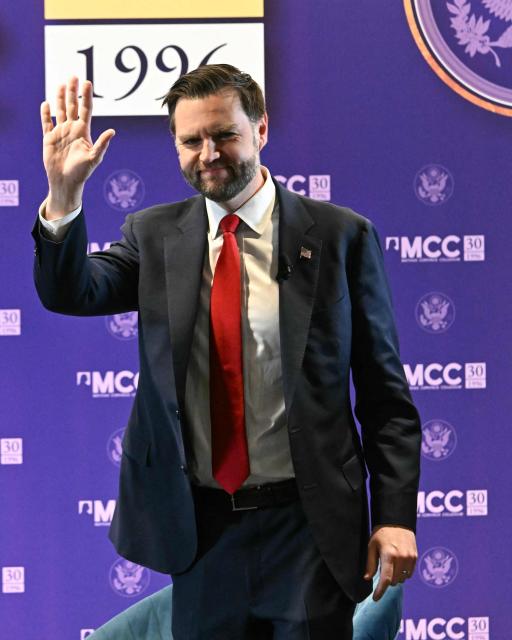 US Vice President JD Vance waves to the audience as he arrives to deliver his remarks at the Mathias Corvinus Collegium in Budapest on April 8, 2026, on the second day of his visit to Hungary. (Photo by Attila KISBENEDEK / AFP)